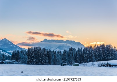 View to the Austrian mountain called Wilder Kaiser from german village Reit im Winkl in beautiful sunset light, copy space