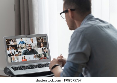 View From Back Above Shoulder On The Laptop With Diverse Employees, Coworkers On The Screen, Video Call, Online Meeting. App For Video Conference With Many People Together