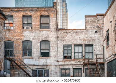 View of the Back Alley with Brick Building, Minneapolis Sky Scrapers and Rusty Fire Escape. - Powered by Shutterstock