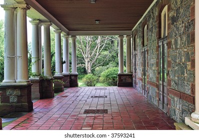 View Of Back Porch Or Veranda Of Historic Hudson Valley Mansion.