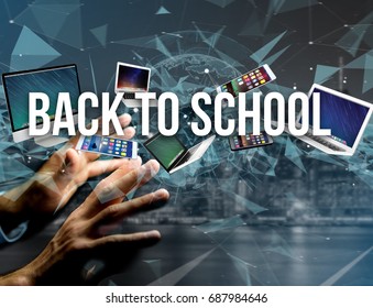 View of a Back to school title surounded by device like smartphone, tablet or laptop - Internet and communication concept