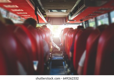 View From Back Seat In A Bus. People Sitting In A Coach. Public Transportation Concept With Summer Vibe.