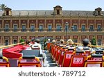 View from back of top deck on open roofed tour bus in Seville, Spain