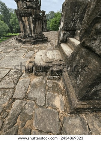 The view of Bakong, intricately detailed step, and surrounding shrines, Siem Reap, Cambodia. 