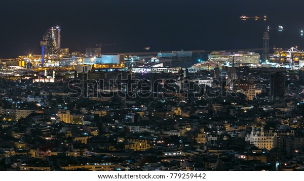 View of Barcelona skyline night timelapse, the\
Mediterranean sea and port of Barcelona with cable car from Bunkers\
Carmel. Catalonia, Spain.\
4K