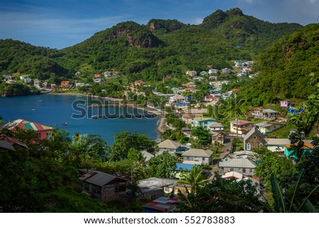 View of Barrouallie with Sea and palm trees in Saint Vincent and the Grenadines, beautiful exotic paradise with mountains and beautiful perfect beaches and colorful turquoise and emerald colored water