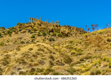 A View From The Base Of Ridge Looking Up At The Temple Of Juno In The Ancient Sicilian City Of Agrigento In Summer