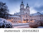 A view of basilica cathederal building facade in snowy evening in Waldsassen