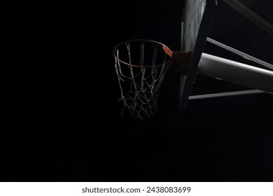 view of the basketball hoop at an empty playground outdoor court at night. Side view of basketball hoop at night. basketball court illuminated only by night sky, basketball hoop, game in urban setting - Powered by Shutterstock