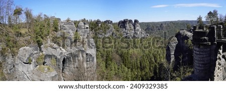View from the Bastei in the Elbe sandstone mountains to viweing platform and rockformations