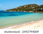 View of the beach of Baia Sardinia, a tourist resort in northern Sardinia Island, famous for the clarity of the sea waters and the beauty of the surrounding landscape.