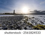 view from the beach to Laboe Naval Memorial, Germany at sunset