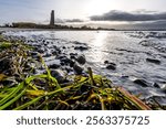 view from the beach to Laboe Naval Memorial, Germany at sunset