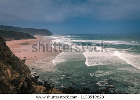 Similar – Aerial Drone View Of Blue Ocean Waves And Beautiful Sandy Beach Shore in Portugal