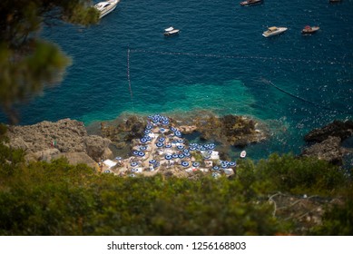 A View Of A Beach With Lots Of Umbrellas In Capri Italy