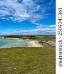 View of the beach from the top of the Seven Sisters chalk cliffs, UK.