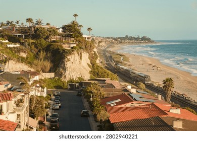View of beaches and cliffs with oncoming train in San Clemente, Orange County, California