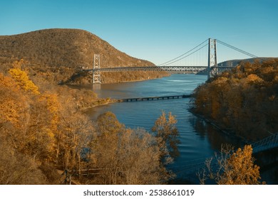 View of the Bear Mountain Bridge with fall color in the Hudson Valley, New York