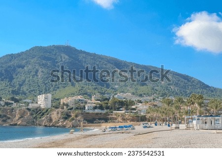 View to beautiful Albir town with main boulevard promenade, seaside beach and Mediterranean sea. Albir is small resort between Altea and Benidorm, L'Alfas del Pi municipality, Alicante province, Spain