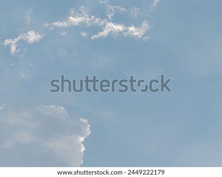 A view of beautiful blue sky on the evening with floating white clouds.