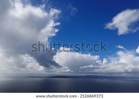 view of beautiful clouds, storm cloud over the ocean, blue sky with white clouds, rain