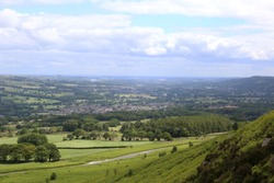 View Of The Beautiful Lower Wharfedale Valley Yorkshire, Looking From The Edge Of Ilkley Moor Towards The Small Towns Of Burley In Wharfedale And Otley.