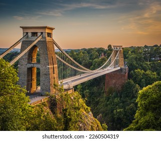 View of beautiful suspension bridge over a gorge at sunset - Powered by Shutterstock