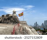 View of the beautiful waving flag of Colombia and Cartagena 