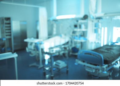 View of the beds and equipment at emergency room as a concept of hospital life, defocused background.