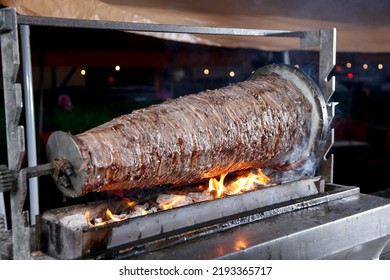 A View Of Beef Shawarma Cooked On A Rotisserie Spit, Seen At A Local Lebanese Restaurant.
