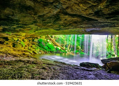 View from behind a tranquil waterfall