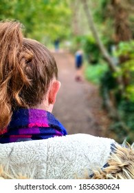 a view from behind walking down a long path