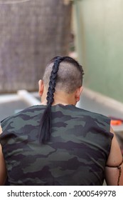 View From Behind Of Young Man With , Long Hair And Hair Bun