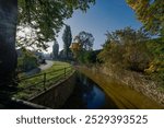 View of Bela river flowing through Pelhrimov, yellow leaves, autumn