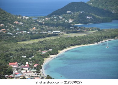 View from Belair, Carriacou, one of the islands off the coast of Grenada. In this photo the town of Hillsborough and the ocean can be seen.