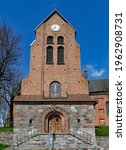 View of the bell towers in the vicinity of the Catholic church of St. Achacjusz in the village of Czernice Borowe in Masovia in Poland.