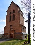 View of the bell towers in the vicinity of the Catholic church of St. Achacjusz in the village of Czernice Borowe in Masovia in Poland.