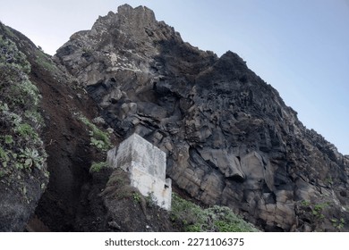 View from below on the steep slope of the mountain. Rocks fall on the road - Shutterstock ID 2271106375