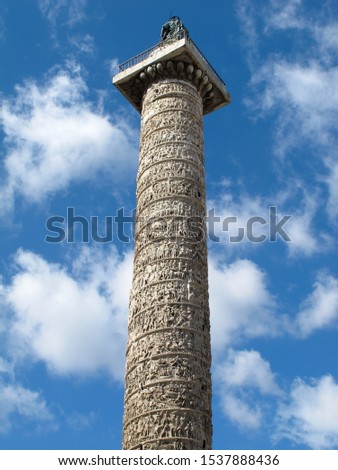 A view from below of Trajan's Column in Rome, Italy.  It is known as Colonna Traiana in Italian, and is a triumphal column that commemorates a war victory that was completed in AD 113. 