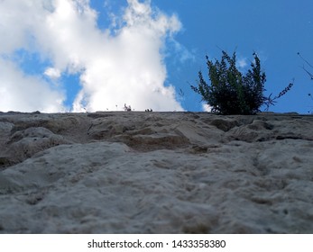 View from below of a wall.