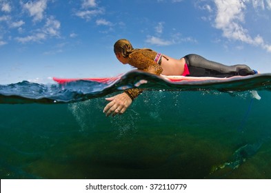 A View From Below The Waters Edge On A Surfer Enjoying The Waves On The Westcoast Of Reunion Island