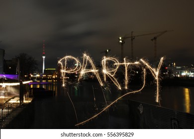 View At The Berlin Silhouette At Night. With The Word PARTY Written In Sparkling Light. It Is One Of Europe´s Most Popular Travel Destinations For Clubbing And Parties.