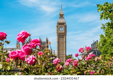 View of the Big Ben clock tower above flowers on opposite riverbank. London, England - Powered by Shutterstock