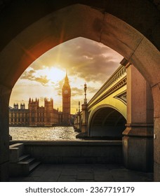 View of Big Ben and sun  through the pedestrian tunnel at sunset, London.