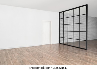 View Of Big Empty Room With Door And Folding Screen