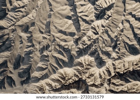 View of the bizarre mountain surface of the Moon canyon