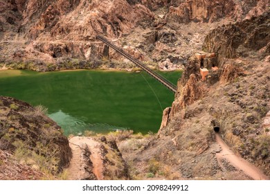 View Of The Black Bridge And Tunnel Over The Colorado River From The River Trail In The Grand Canyon