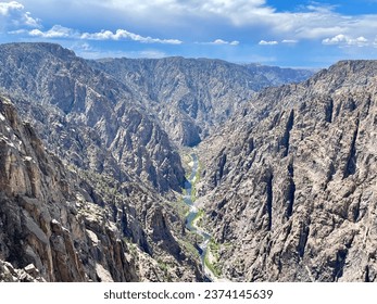 a view of a black canyon with a river running through it