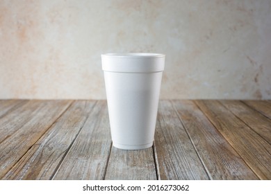 A View Of A Black Coffee Inside A White Styrofoam Cup.