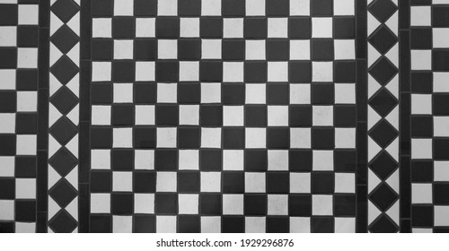 View of black and white tiled chequered Victorian floor from above - Shutterstock ID 1929296876